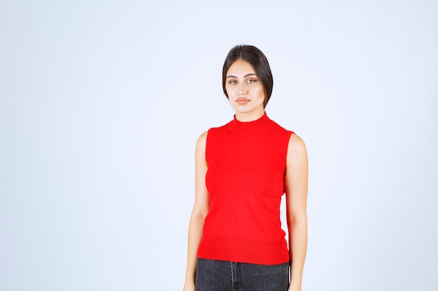 Girl in red shirt giving neutral, positive and appealing poses.