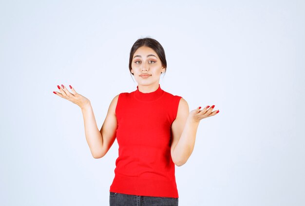 Girl in a red shirt giving positive and seductive poses.