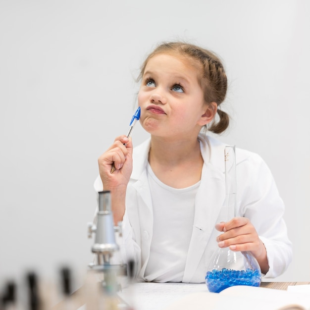 Girl in science class doing research