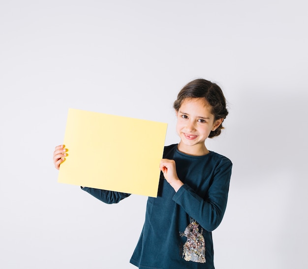 Girl showing paper sheet