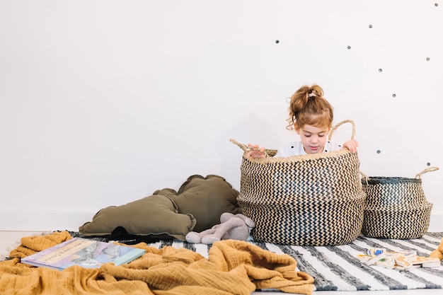 Free Photo girl sitting in basket