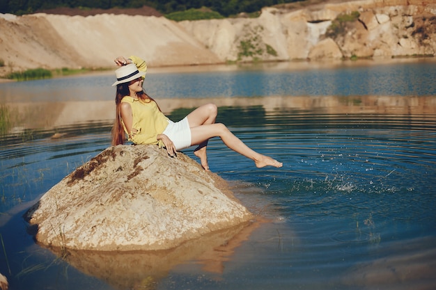 Girl sitting near river