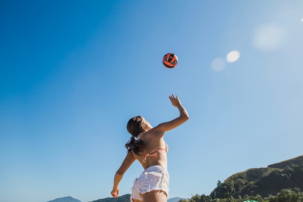 Girl smashing volleyball