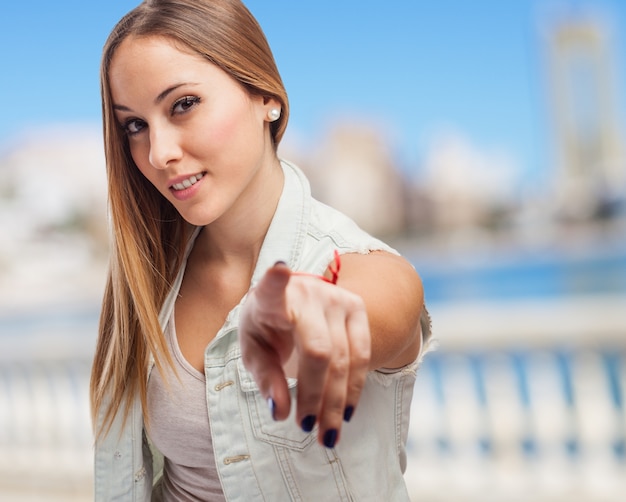 Girl smiling and pointing