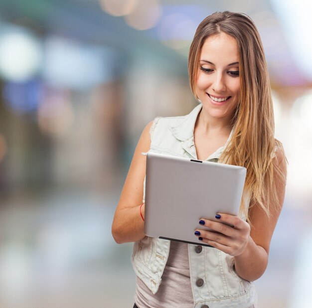 Girl smiling with a tablet