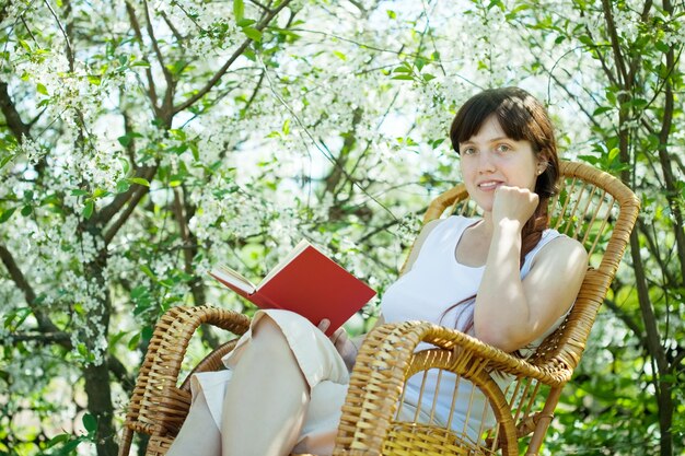 girl in spring blossoming garden