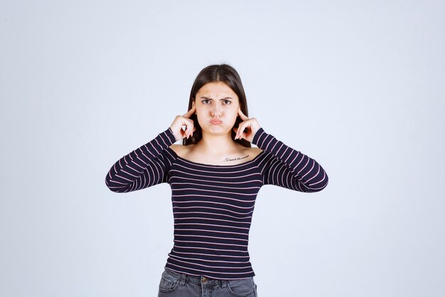 Girl in striped shirt thinking and brainstorming.