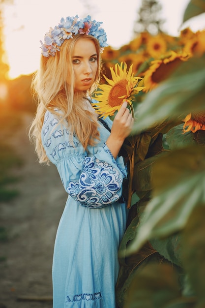 Free photo girl and sunflowers