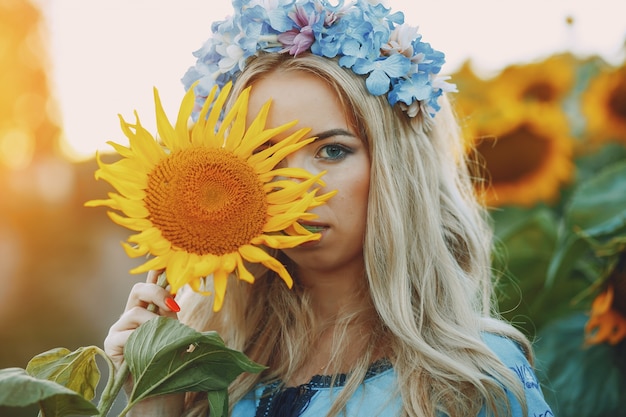 Free photo girl and sunflowers