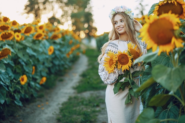 Free photo girl and sunflowers