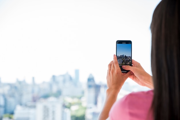 Girl taking picture of landscape