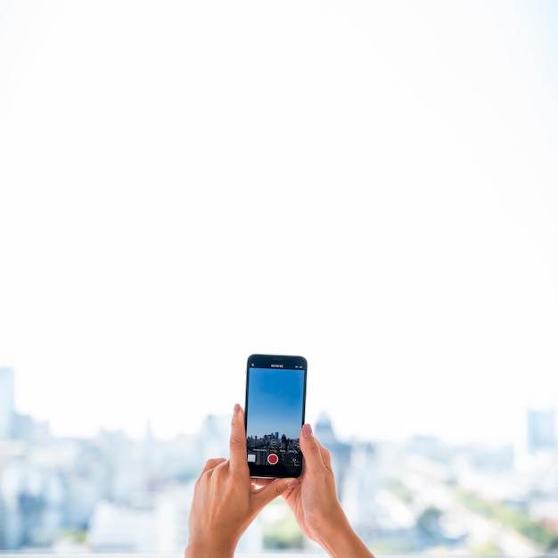 Girl taking picture of landscape