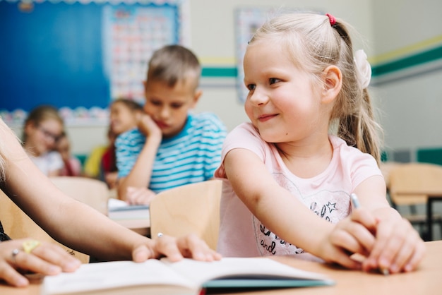 Free Photo girl talkign to anonymous classmate