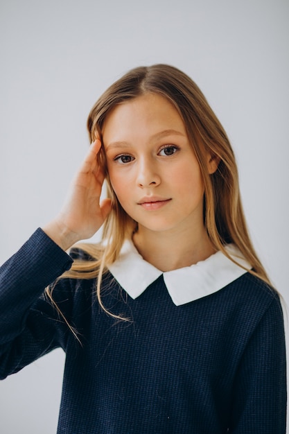 Girl teenager in school uniform