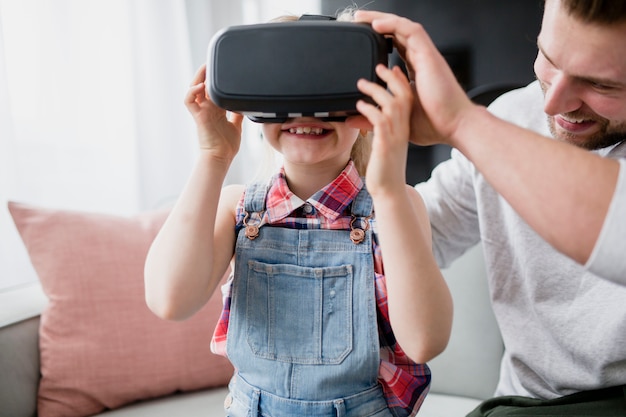 Free photo girl in vr goggles near father