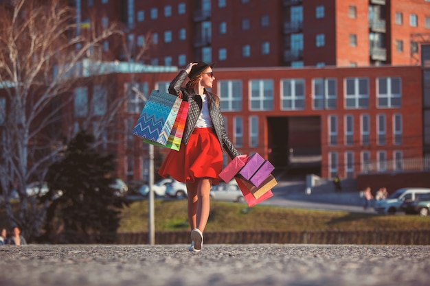 Free photo the girl walking with shopping on city streets