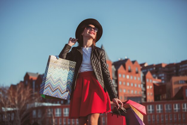 Free photo the girl walking with shopping on city streets