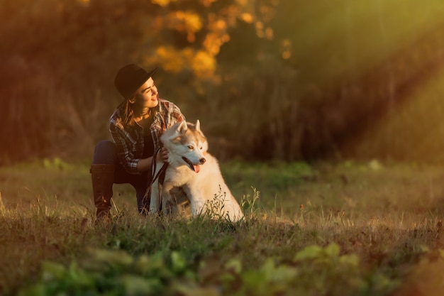 girl walks with husky