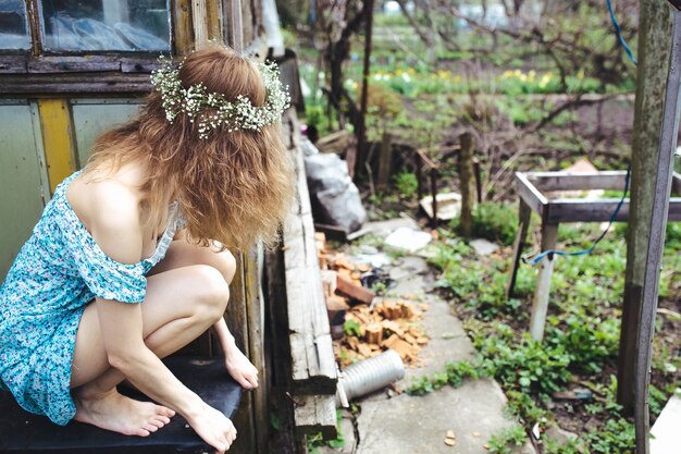 Free Photo girl watching the messy garden