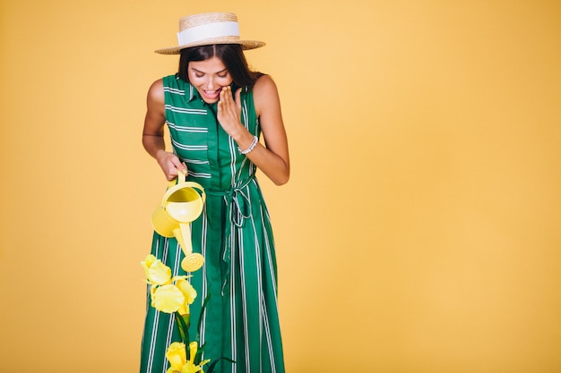 Free photo girl watering flowers