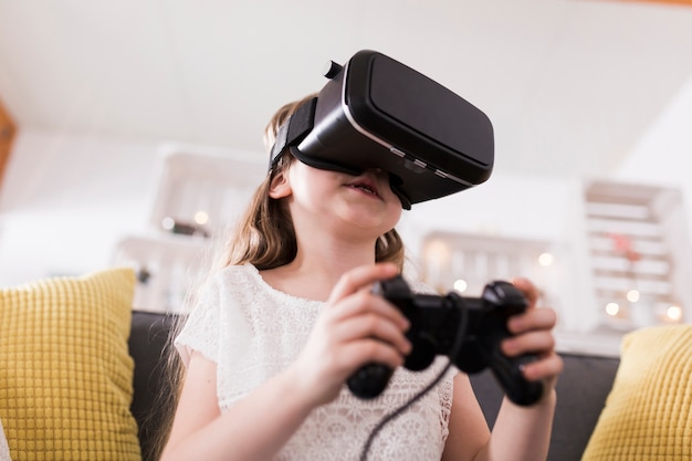 Free photo girl wearing vr glasses