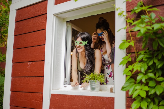 Free photo girl at the window smiling