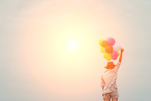 Free photo girl with colorful balloons