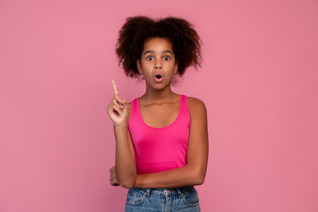 Girl with curly hair pointing up