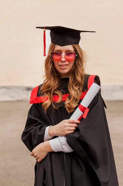 Free Photo girl with diploma at graduation