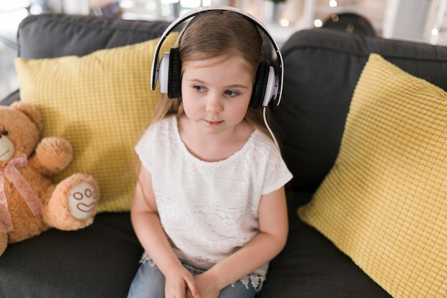 Girl with headphones at home