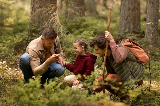 Free Photo girl with her dads enjoying family trip