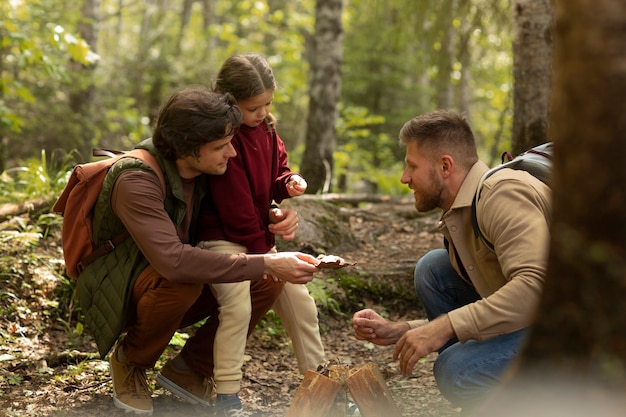 Free Photo girl with her dads enjoying family trip