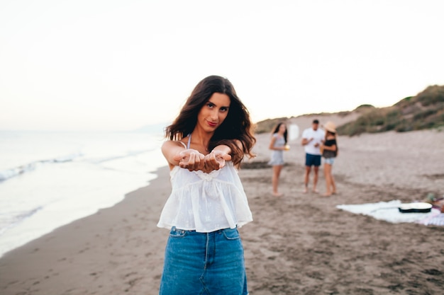 Free Photo girl with her friends at the beach