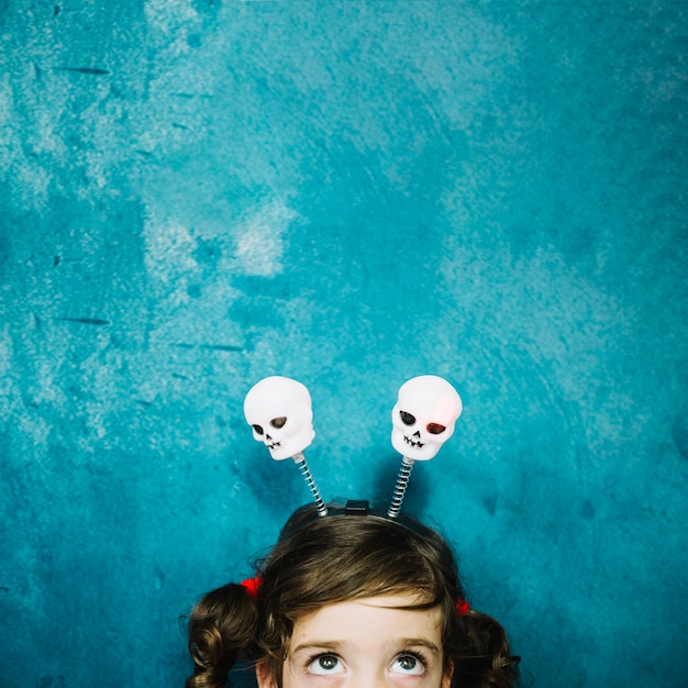 Free photo girl with skull in hairstyle