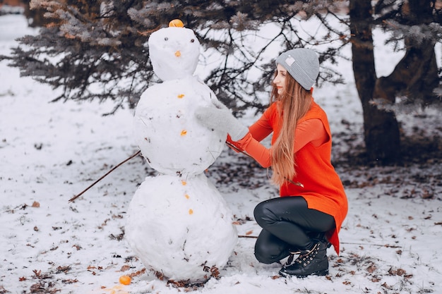 Free photo girl with snowman