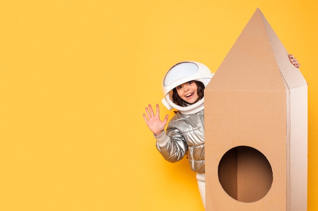 Free Photo girl with space costume waving