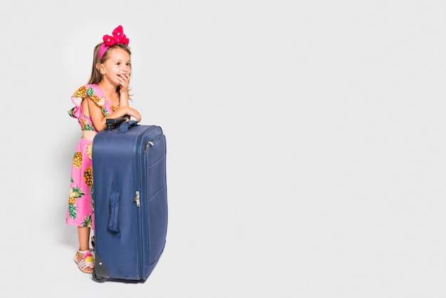 Free photo girl with suitcase