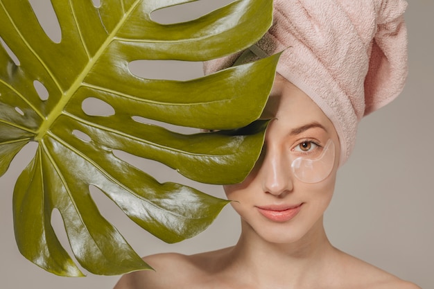 Free photo girl with towel on the head with leaf