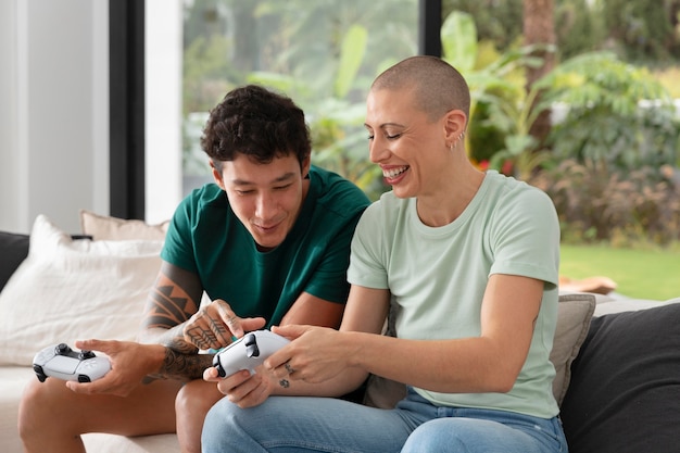 Girlfriend and boyfriend playing video games together at home