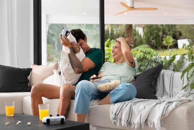 Girlfriend and boyfriend playing video games together at home