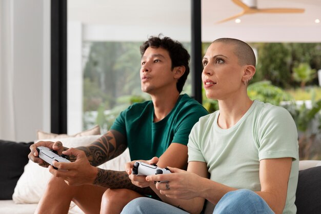 Girlfriend and boyfriend playing video games together at home