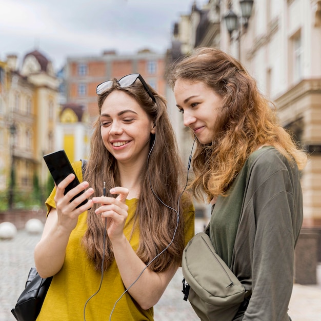 Girlfriends checking mobile