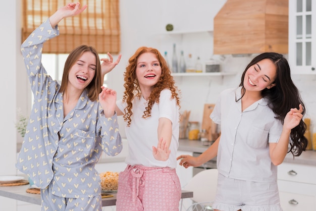 Girlfriends having pijama party at home