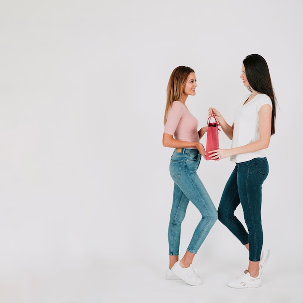 Girlfriends with paper bag