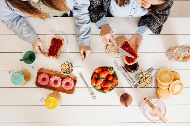 Girls enjoying sweet colorful meal