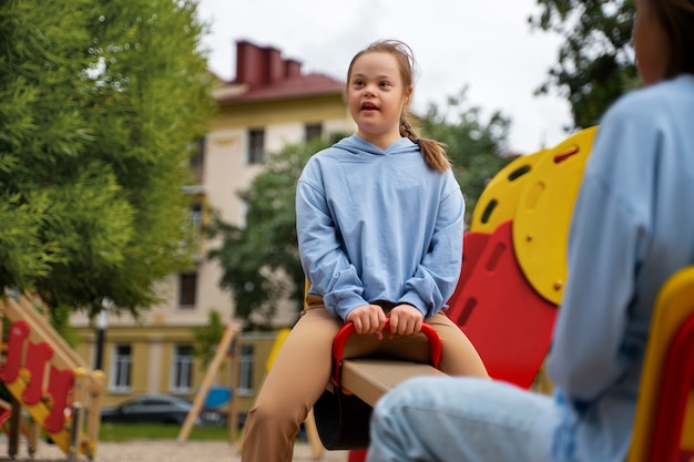 Free photo girls having fun in park side view