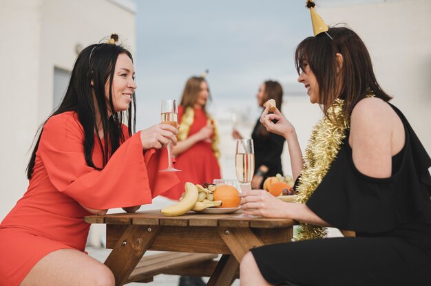 Girls having fun on a party on the rooftop