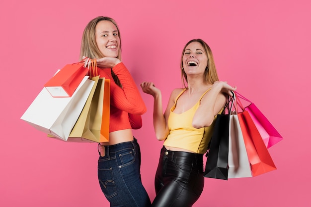 Free photo girls holding shopping bags