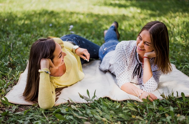 Girls in nature looking at each other