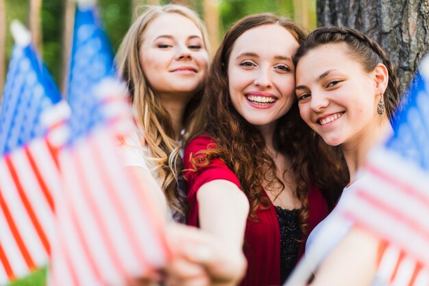 Girls in nature with american flags